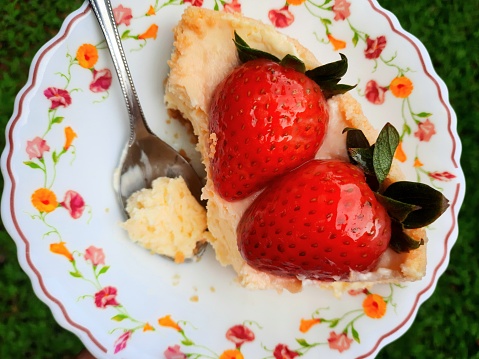 Eating Strawberry Cheesecake.