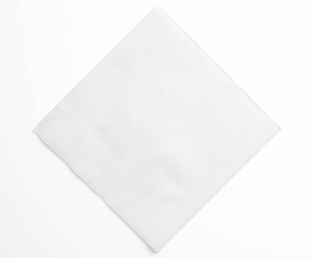 Isolated shot of blank white paper napkin on white background High angle view of blank white paper napkin isolated on white background with clipping path. napkin photos stock pictures, royalty-free photos & images
