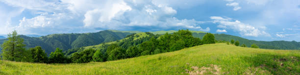 istock Mountains landscapes from green meadow on sunset 1740713196