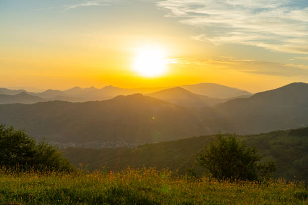 istock Mountains landscapes from green meadow on sunset 1740713732