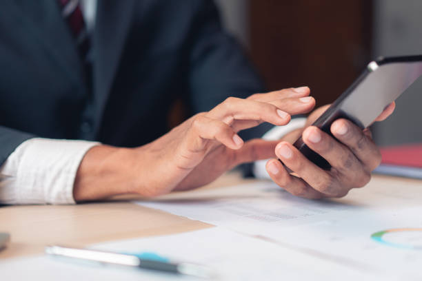 istock Businessman using smartphone to checking report while analysis financial and accounting of project 1740718825