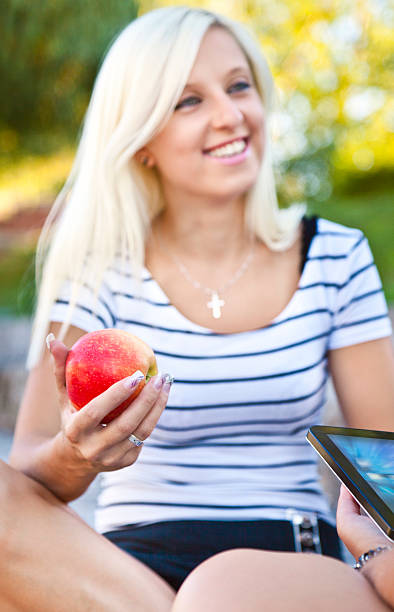 istock Young adult holding an apple 174072271