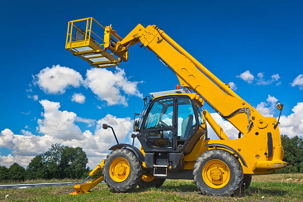 Hydraulic Lift Summer scene with yellow hydraulic lift crane machinery stock pictures, royalty-free photos & images