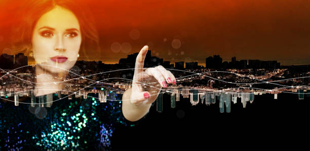 istock Female hand against beautiful night sity with red sky background 1740726452