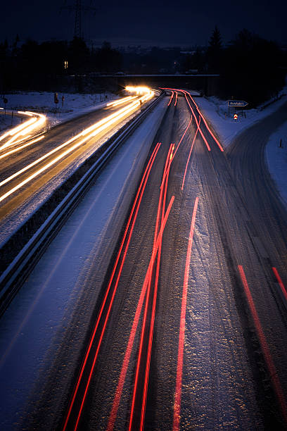 istock Snow-covered highway at night - long exposure, blurred motion 174072700