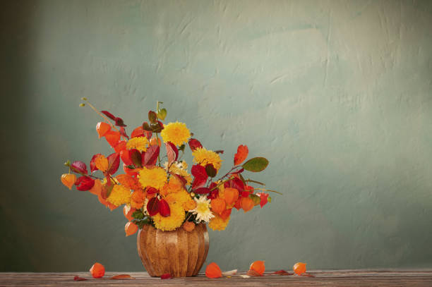 istock beautiful autumnal  bouquet on wooden table on dark wall 1740729398