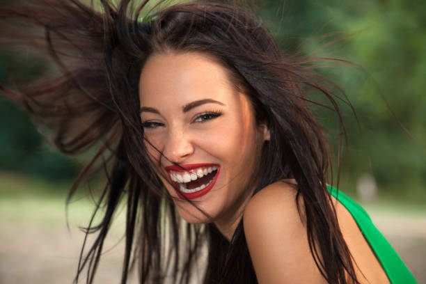 istock Beautiful young woman smiling 174073346
