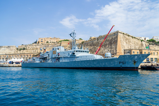 Floriana, Malta - June 10th 2016: Irish Navy Vessel Le Roisin (P51) moored at the Valletta Waterfront in front of the Floriana Lines fortifications.