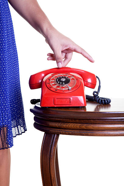 donna telefono chiuso rosso - landline phone women close up old fashioned foto e immagini stock