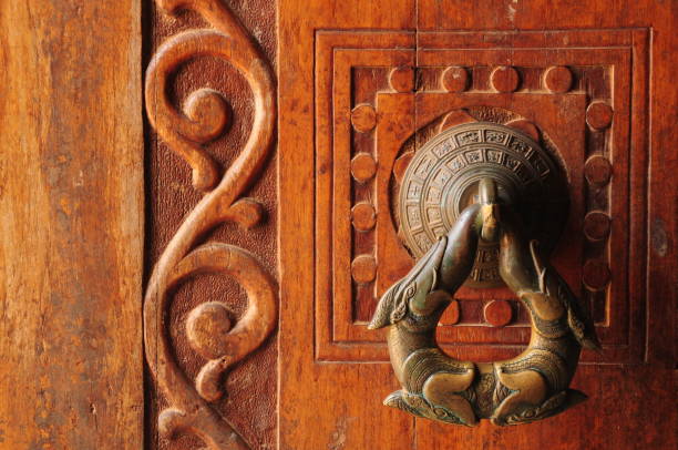 Telephoto image of temple entrance door and knocker.