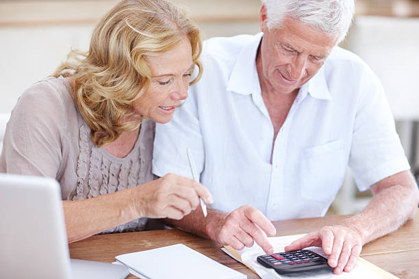 istock Calculating their monthly budget 174074134