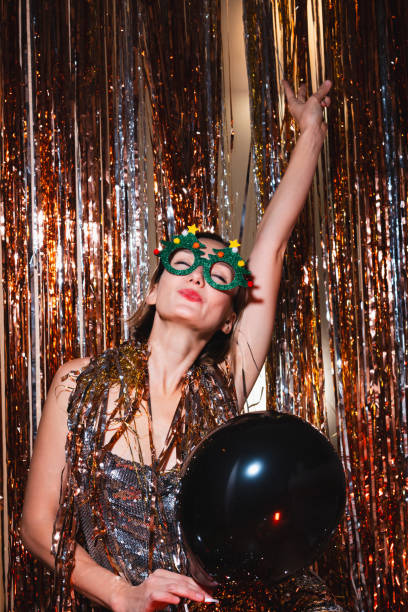istock Happy woman celebrating New Year. 1740741983