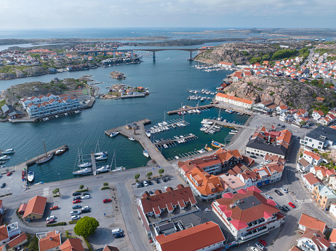 Aerial view of Kungshamn, a popular tourist destination on the west coast of Sweden. In the background is the bridge to Smögen, another small town and tourist destination.