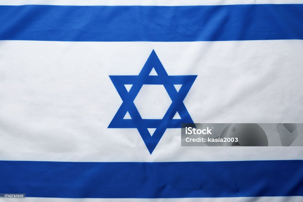 Israel flag. Independence Day of Israel. Israel flag beautifully waving wave with star of David over white wooden background. National pride of Israel. Patriotism and commonwealth. Top view. Mock up. Israeli Military Stock Photo