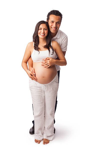 Latin couple expecting a baby Latin couple expecting a baby 8 months pregnant stock pictures, royalty-free photos & images