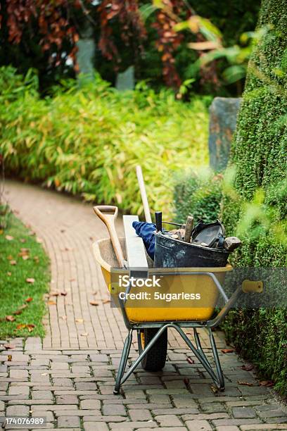 Wheelbarrow With Instruments In A Garden Stock Photo - Download Image Now - Wheelbarrow, Leaf, Autumn