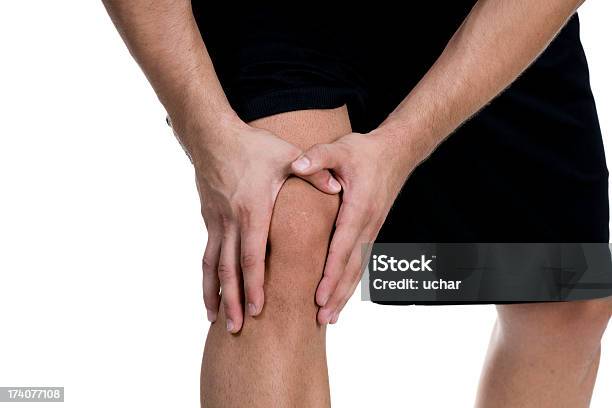 Dolore A Un Trauma Knee Sport - Fotografie stock e altre immagini di Dolore fisico - Dolore fisico, Rosso, Sfondo bianco