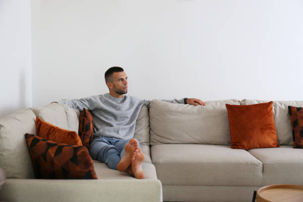 istock Mid adult man chilling on the couch 1740776847