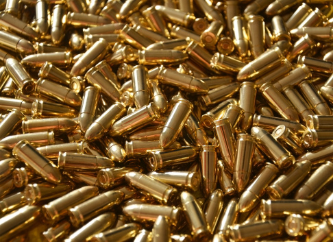 A pile of 9mm bullet ammunition full metal jacket