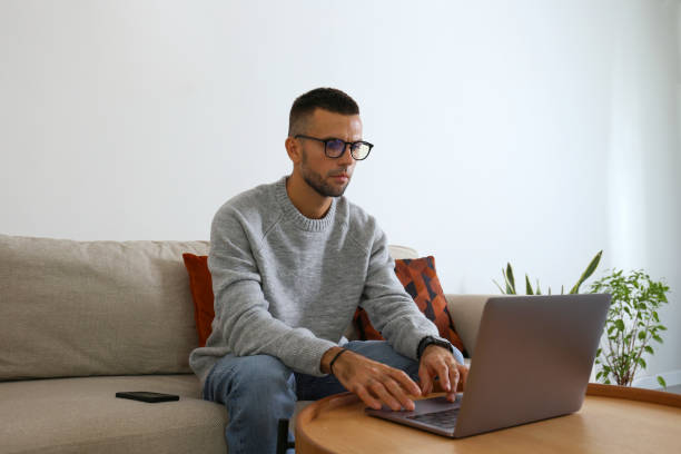 istock Mid adult man working from home. 1740779242