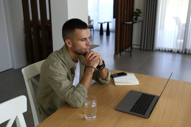 istock Mid adult man working from home. 1740781518