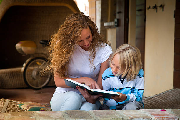 istock Young beautiful girl reading a book 174078540