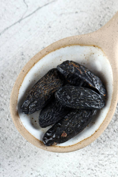 istock tonka beans in a ceramic spoon on the table 1740789826