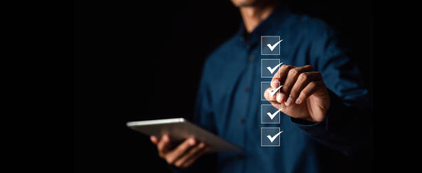 performance checklist, businessman using checklist survey, filling out digital form checklist, take an assessment, questionnaire, evaluation, online survey, online exam.; - acordo imagens e fotografias de stock