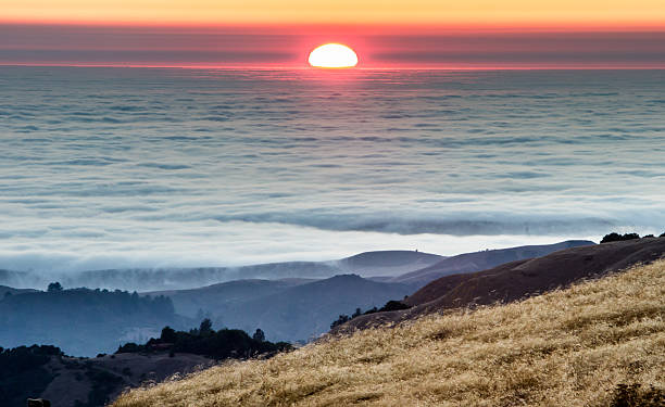 istock Sunset over fog and hills 174079160