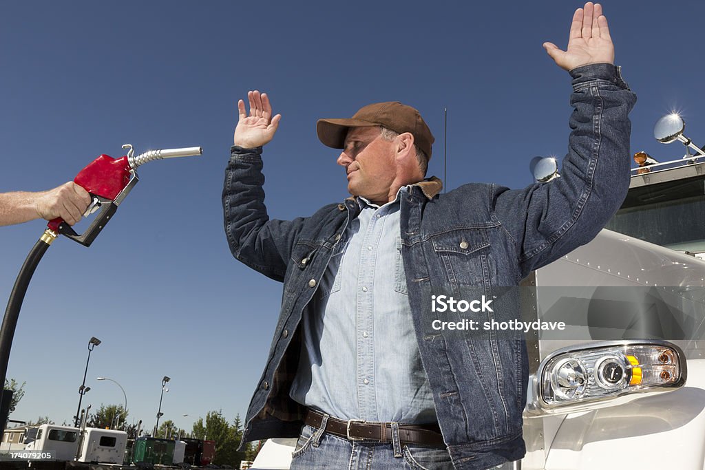 Gas Price Hostage An image from the transportation industry of a truck driver being held up due to high prices. Stealing - Crime Stock Photo