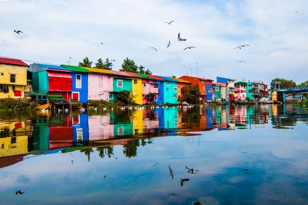 istock many multi - colored houses line the water in this area 1740800558