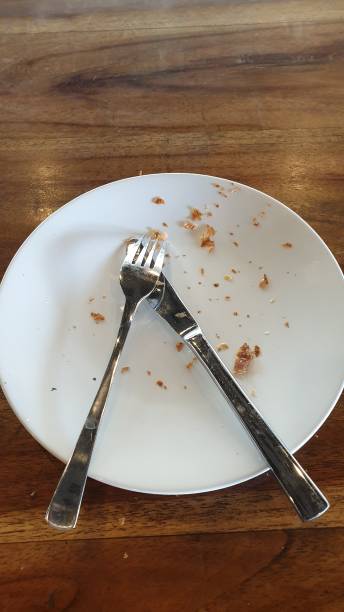 a white plate topped with a fork and a knife