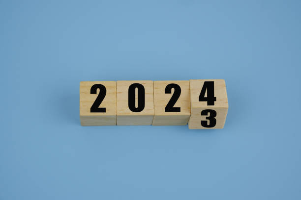 istock Wooden cubes with numbers 2024 and 2023 on blue. 1740824898