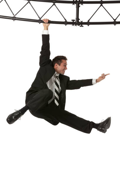 istock Businessman hanging from a metal structure 174082727