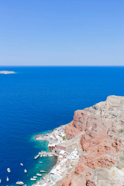 istock Some boats on a tiny dock in a cliff in Santorini, Mediterranean Sea, Greece 1740828215