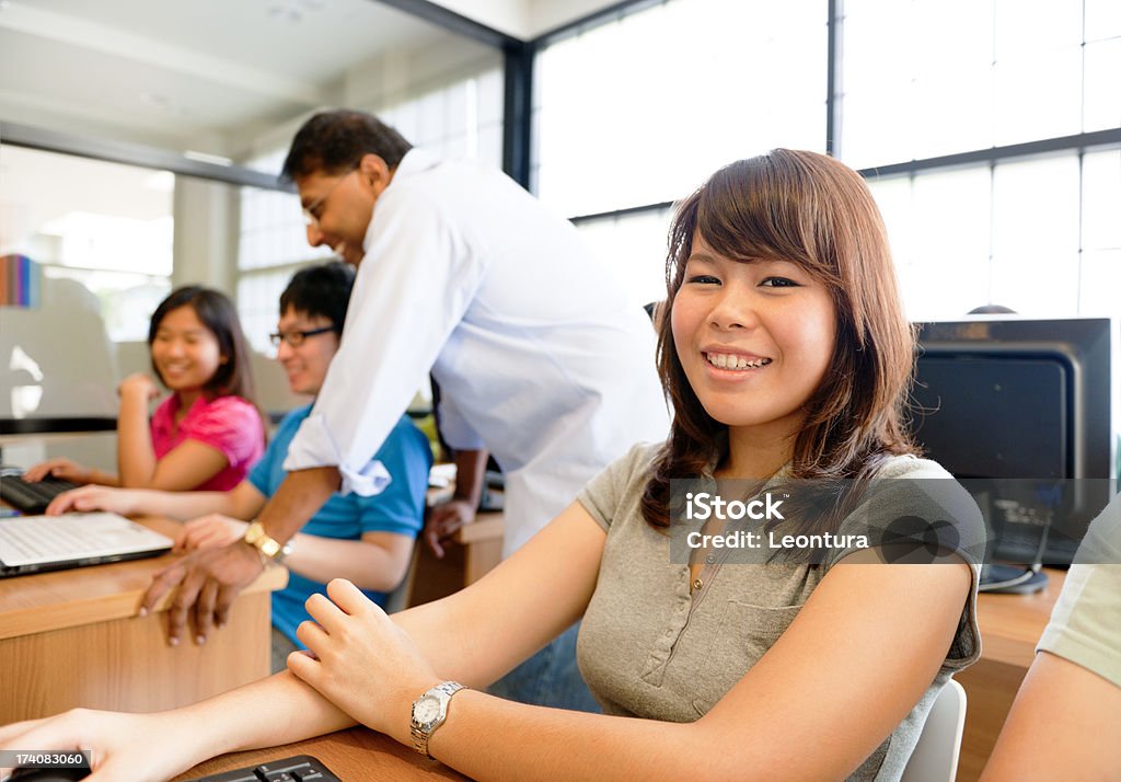 Smile in Class Young woman smiling. Classroom Stock Photo