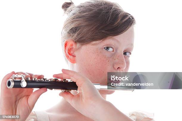 Cute Girl Playing Her Piccolo Stock Photo - Download Image Now - Piccolo, Child, Freckle
