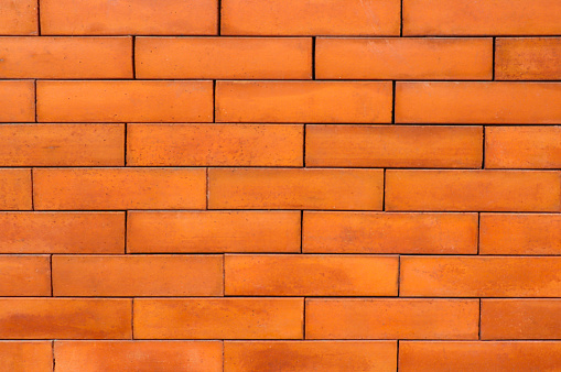 Seamless brown brick wall For background and close-up texture