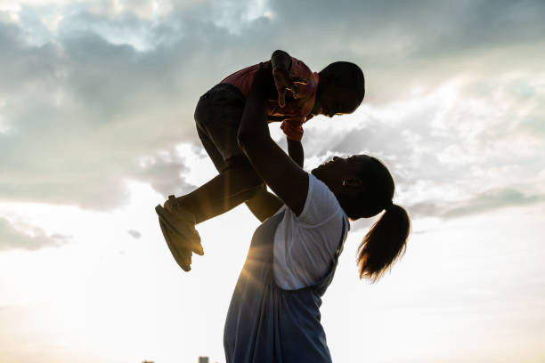 Mother playing with her son outdoors