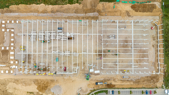 Large construction site - industrial buildings. Aerial view, drone point of view.