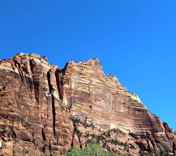 istock a mountain peak surrounded by green trees and rock formations in the desert 1740837668