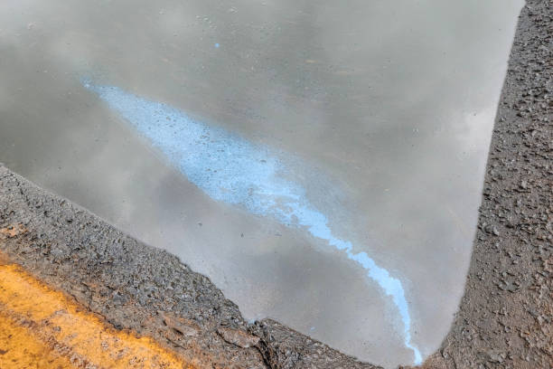 istock Oil spilling into public water. 1740860253