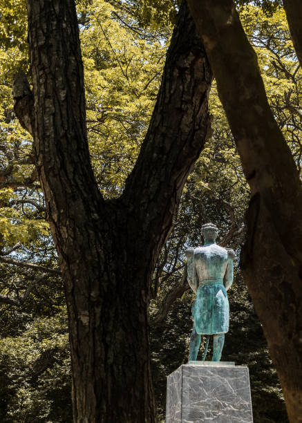 istock Photo of statue in square with trees 1740860326