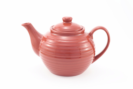 red teapot on a white packground