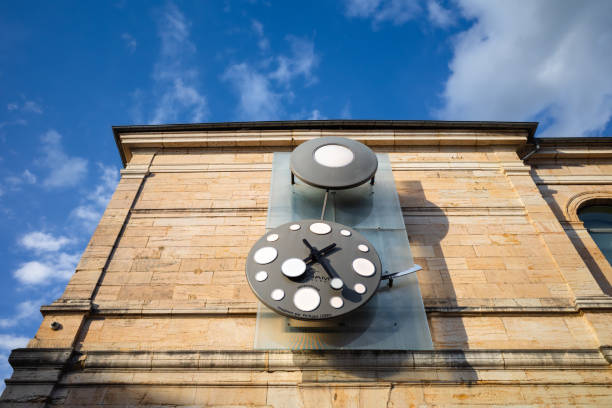 Besancon, France - August 7, 2023: A modern pendulum clock designed by Philippe Lebru on the wall of the museum of fine arts and archeology
