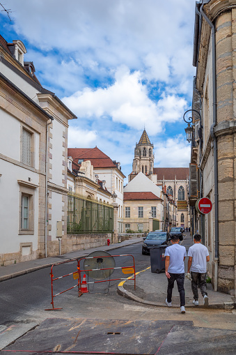 Dijon, France - August 8, 2023: People walking on the pavement of the old town of Dijon, Burgundy.