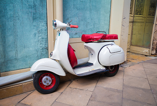 Dijon, France - August 8, 2023: Very well preserved stylish old Italian scooter Vespa in Dijon