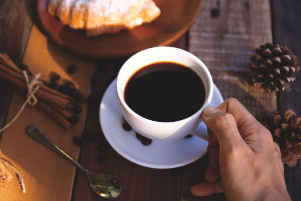 istock Coffee cup hot on wooden table in the morning background 1740891828