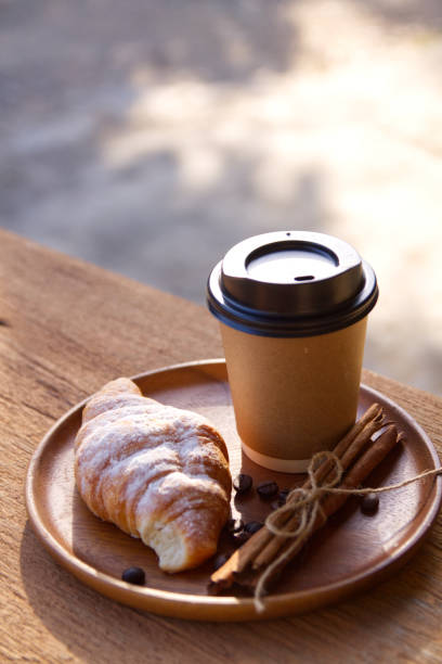 istock Coffee cup hot on wooden table in the morning background 1740892402