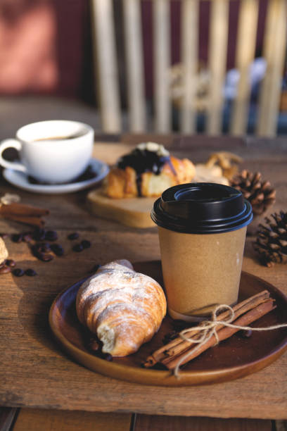 istock Coffee cup hot on wooden table in the morning background 1740892431